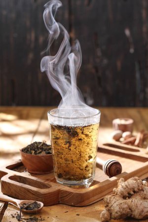 Photo for Hot tea on the wooden table - Royalty Free Image