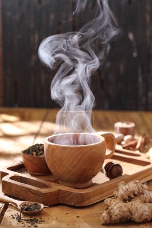 Photo for Tea cup with tea drink on wooden table - Royalty Free Image