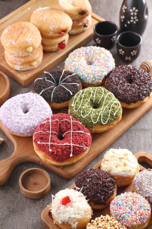 Photo for Donuts and sweets on table - Royalty Free Image