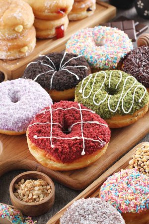 Photo for Delicious donuts with different toppings - Royalty Free Image