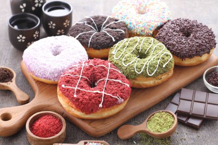 Photo for Assortment of tasty donuts and chocolate on white table - Royalty Free Image