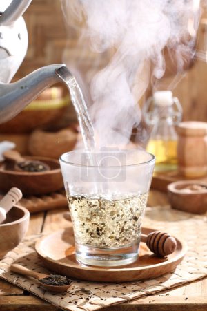 Photo for Hot tea with hot drink on table - Royalty Free Image