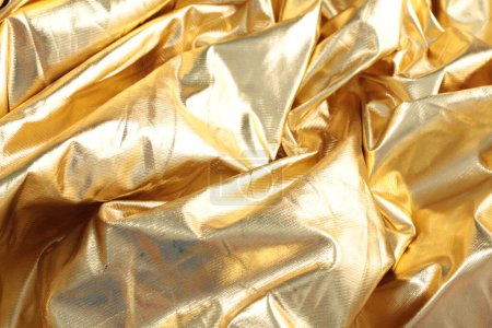 Photo for Golden crumpled shiny foil texture background - Royalty Free Image