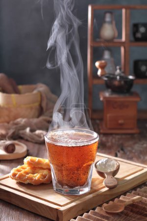 Photo for Hot tea on the table at autumn - Royalty Free Image