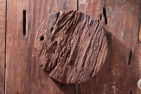 Photo for Old brown wooden door with hole - Royalty Free Image