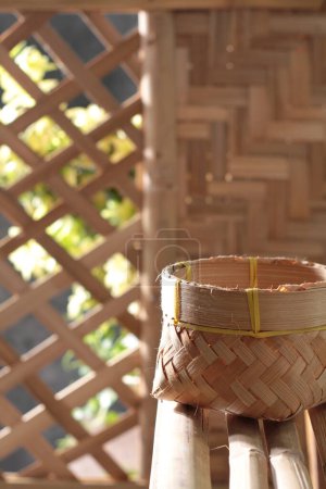 Photo for Bamboo basket with bamboo sticks - Royalty Free Image