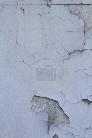 Photo for Texture of an old wall with peeling paint. which can be used for a background of a cracked paint. a cracked surface. - Royalty Free Image