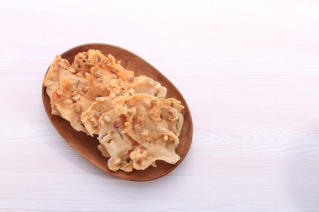 Photo for Fried pork with garlic on wood background - Royalty Free Image