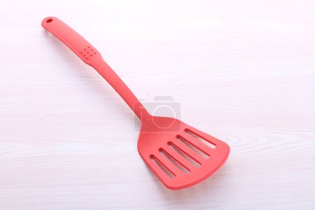 Photo for Red plastic fork on a white background - Royalty Free Image