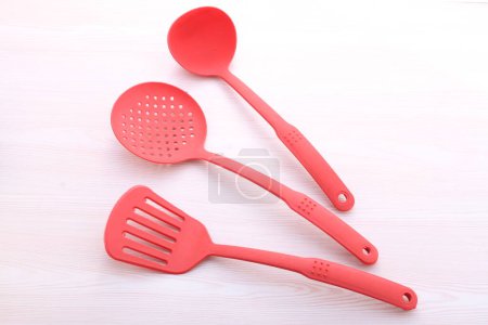Photo for Kitchen spoon on wooden background - Royalty Free Image