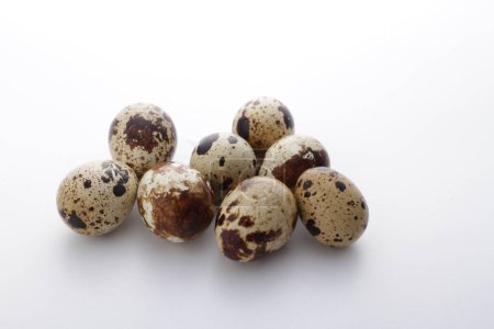 Photo for Quail eggs in a white background. - Royalty Free Image