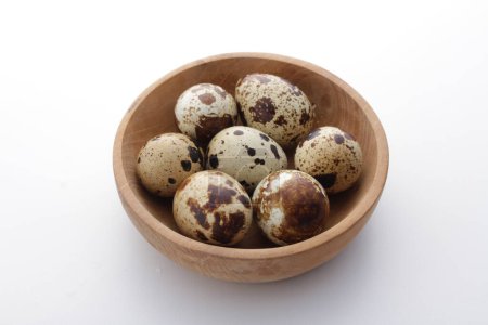 Photo for Quail eggs in a bowl on a white background - Royalty Free Image
