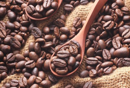 Photo for Roasted coffee beans on wooden background - Royalty Free Image