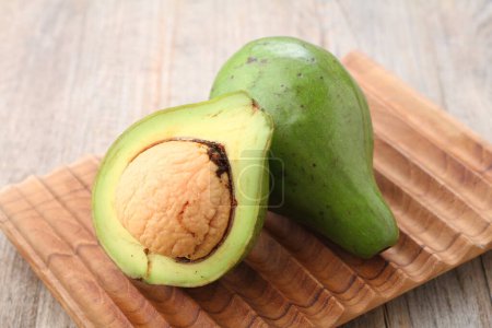 Photo for Fresh avocado on wooden background - Royalty Free Image