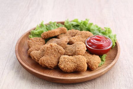 Photo for Fried chicken nuggets with sauce and lettuce - Royalty Free Image