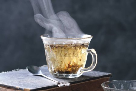 Photo for Hot cup of tea with ice cubes - Royalty Free Image