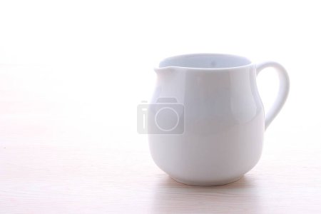 Photo for White cup on the white table. white background. - Royalty Free Image