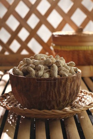 Photo for Fresh walnut in a bowl on a wooden table - Royalty Free Image