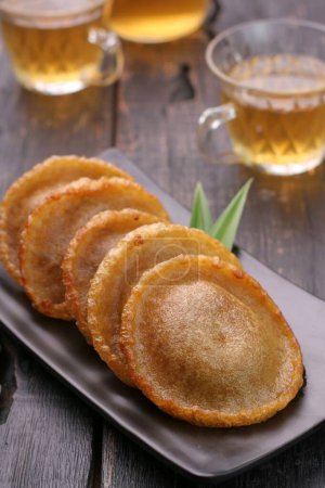 Photo for Moon cake in a bowl and tea - Royalty Free Image