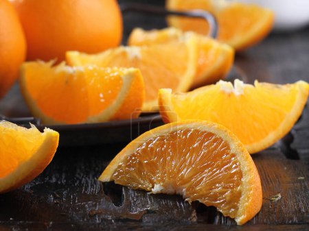 Photo for Fresh orange fruit on a wooden table - Royalty Free Image