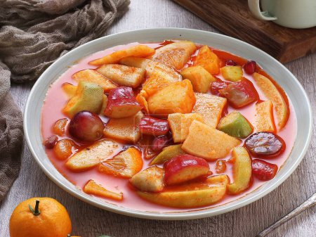 Photo for Fruit compote with plums and cinnamon - Royalty Free Image