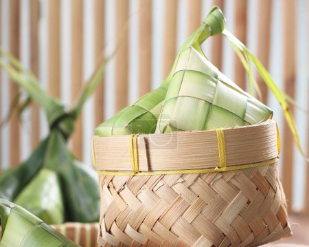 Photo for Bamboo basket with bamboo on the bamboo mat - Royalty Free Image