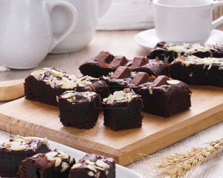 Photo for Homemade brownies with walnuts and chocolate topping - Royalty Free Image