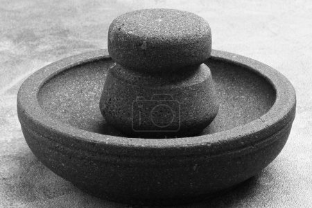 Photo for Mortar and pestle on a black background - Royalty Free Image