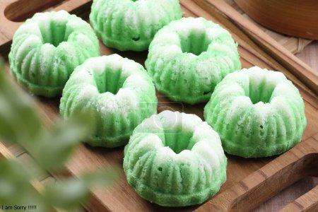 Photo for A tray of green bundts on a wooden tray - Royalty Free Image