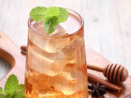 Photo for A glass of iced tea with ice and mint - Royalty Free Image