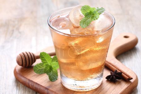 Photo for A glass of iced tea with ice and mint - Royalty Free Image
