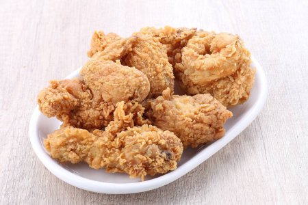 Photo for A plate of fried chicken on a table - Royalty Free Image