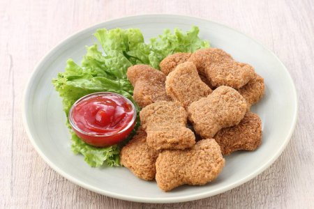 Photo for A plate of fried chicken nuggies with ketchup - Royalty Free Image