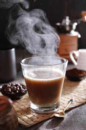 Photo for A cup of coffee with steam rising out of it - Royalty Free Image