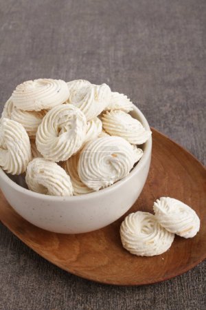 Photo for A bowl of meringue on a wooden plate - Royalty Free Image