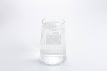 Photo for A glass of water on a white surface - Royalty Free Image