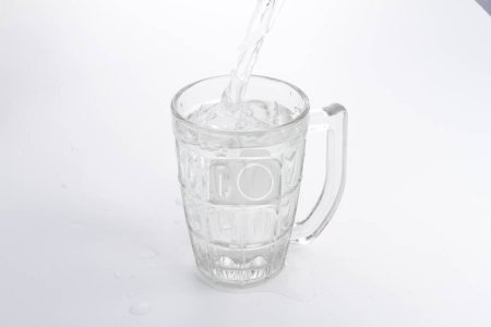 Photo for A glass of water being poured into a glass - Royalty Free Image
