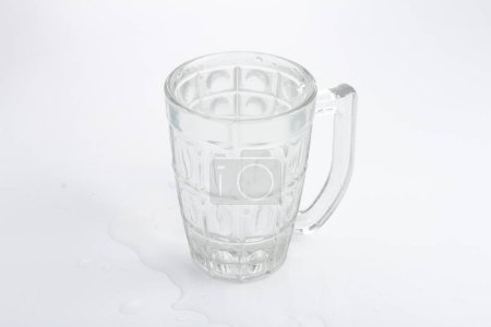 Photo for A glass mug with a handle on a white surface - Royalty Free Image