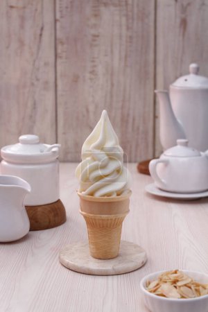 Photo for Cup with delicious ice cream and marshmallows on wooden table - Royalty Free Image