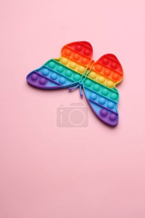 Photo for Toy rainbow heart on a pink background - Royalty Free Image