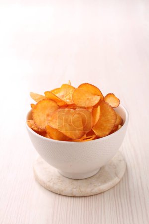 Photo for Potato chips on a white dish - Royalty Free Image
