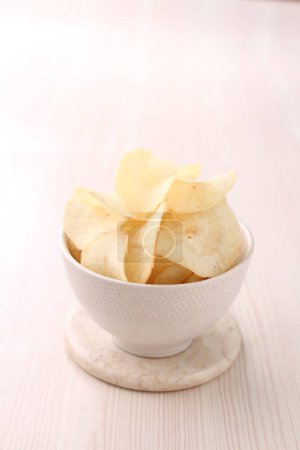 Photo for Chips in a bowl on white background. - Royalty Free Image