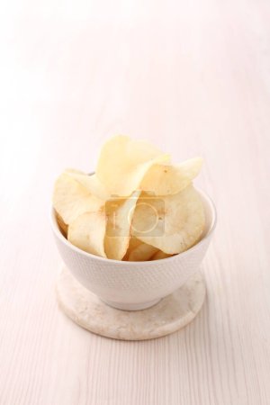 Photo for Potato chips on a white plate - Royalty Free Image