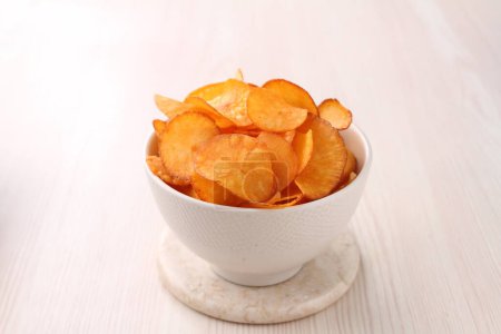 Photo for Potato chips on white plate - Royalty Free Image