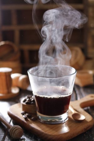 Photo for Hot coffee on wooden desk - Royalty Free Image