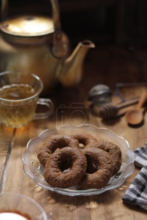 Photo for Cup of tea with cinnamon and cookies - Royalty Free Image