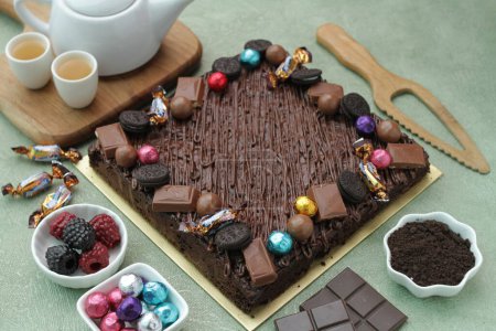 Photo for Chocolate easter cake on wooden table - Royalty Free Image