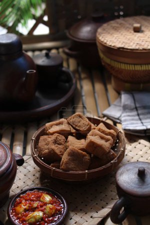 Photo for Savory and delicious fried tofu served with garlic chili sauce and petai - Royalty Free Image