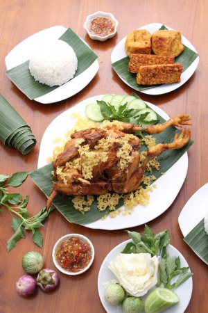 Photo for Indonesian food, fried rice, fried chicken, served on plate, with fried chicken and chili sauce - Royalty Free Image