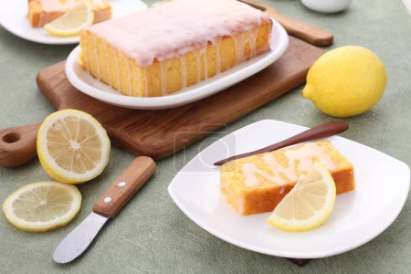 Photo for Homemade lemon cake and lemon slice with icing sugar - Royalty Free Image